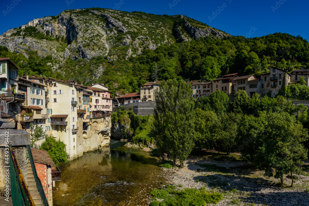 rural landscape with a view on the town of pont en royans and her houses on the cliff