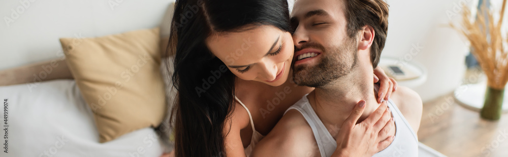 happy young woman hugging cheerful boyfriend, banner happy young woman hugging cheerful boyfriend, banner