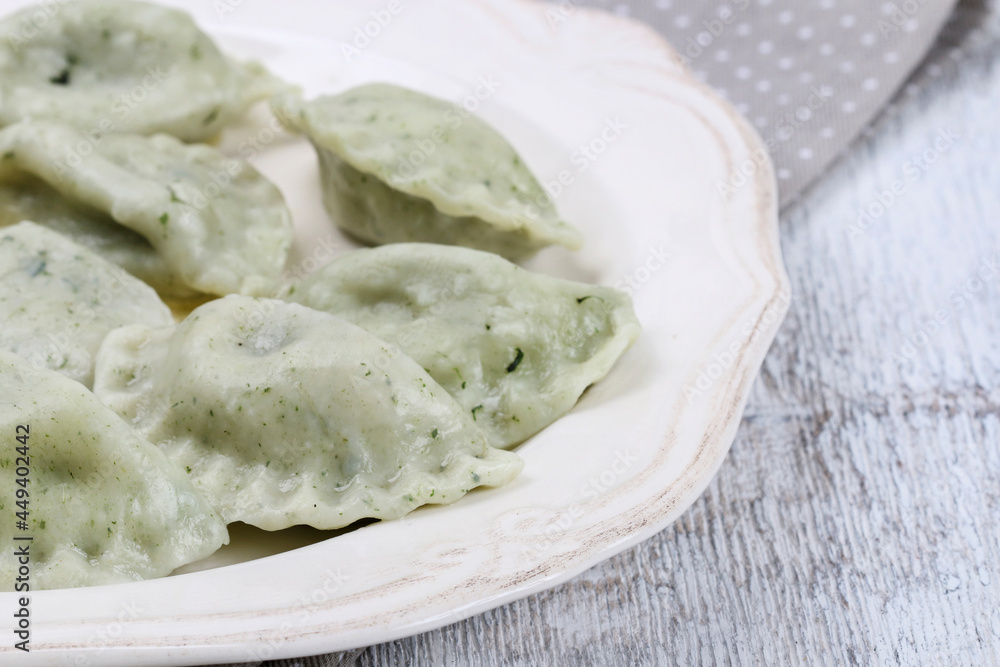 Green dumplings with spinach on the plate. Green dumplings with spinach on the plate.