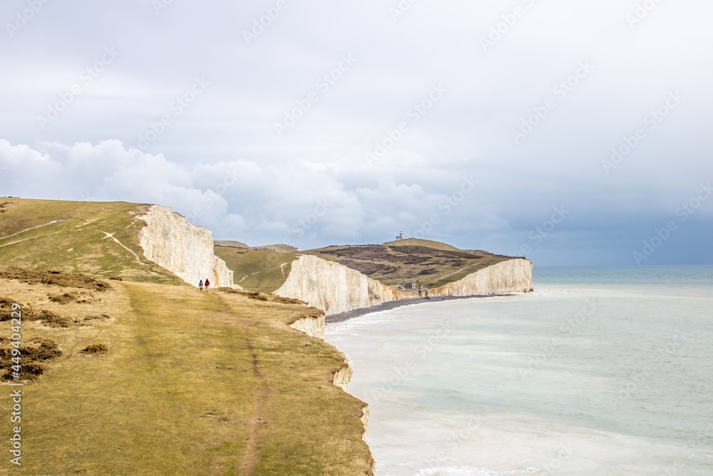 a walk along the South Downs Way on the top of the Seven Sisters Sussex England on a stormy spring day