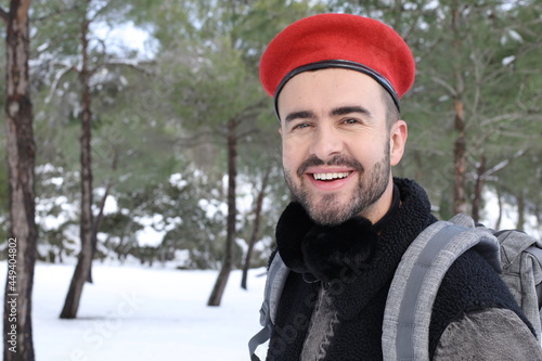 Man wearing red beret in the snow