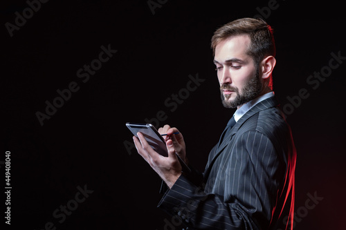 Man with a tablet on a blac...