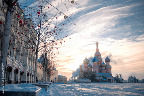 Russia, Moscow, Red Square, 2021-01-17  - winter mood, sun over the Kremlin and St. Basil's Sabor, Christmas Fair, tourists, Balchug, Vasilyevsky Spusk. photo