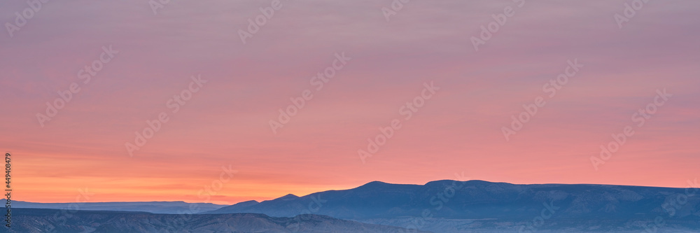 colorful sky over foggy Yampa River at dawn near Dinosaur National Monument in north western Colorado, panoramic web banner