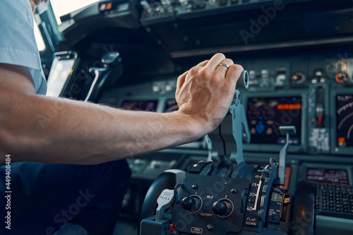 Experienced airline captain increasing the engine thrust