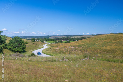 View of a road at the hilly landscape Brösarps Backar located south east Sweden photo