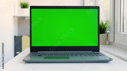 Wallpaper Mural Close up laptop green screen. Chroma key green screen computer set up for work on desk at home, technology concept 4k video template Torontodigital.ca