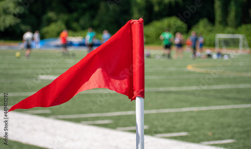 Red corner flag at recreational soccer game