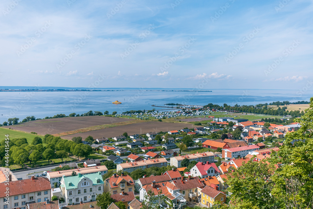 The town of Gränna in Sweden as seen from the Gränna mountain with Lake Vättern and Vising island in the horizon