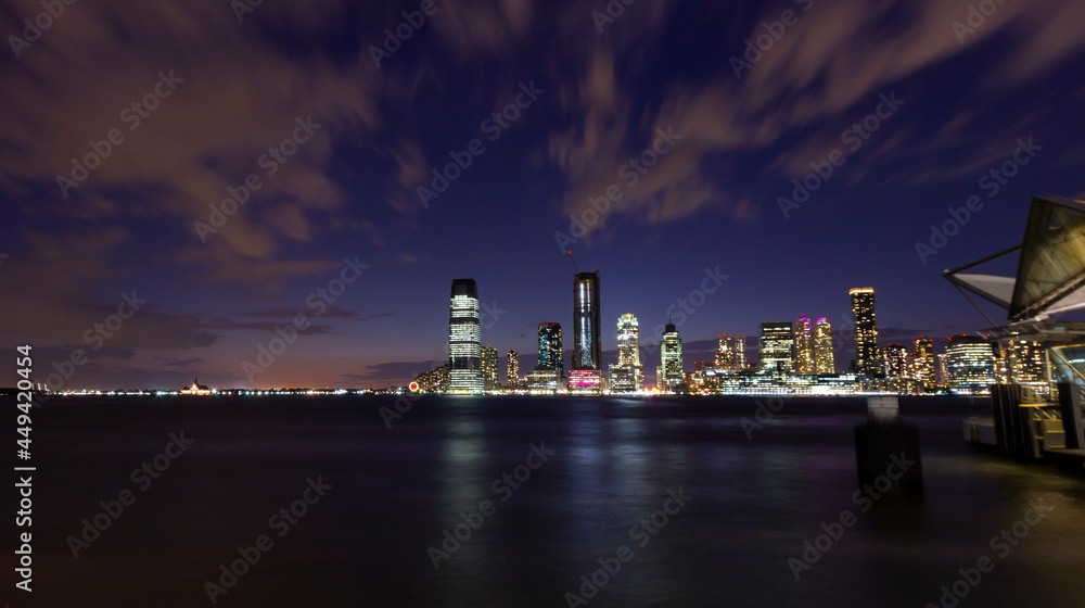 A panorama picture of Manhattan skyline at night with One World Trade Center