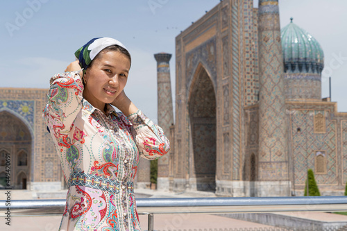 Muslim girl puts a scarf on her head photo