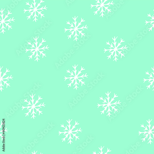 Seamless pattern of snowflakes on a blue background. Doodle illustration.