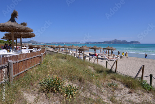 terrazas y zona de sombrillas en las playas de Muro en la costa noreste de isla de Mallorca, Baleares photo