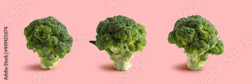 three broccoli on pink background