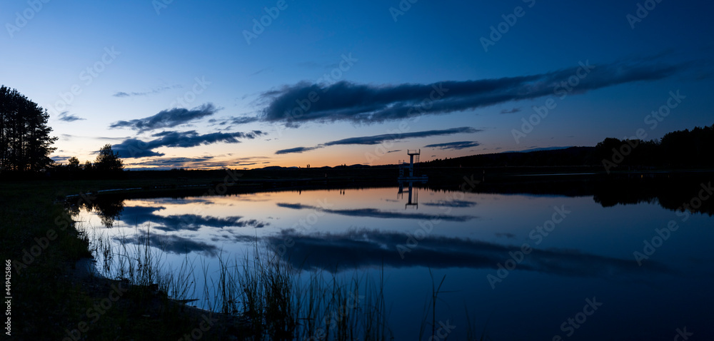 A long exposure of the lake Luspen in Storuman in the Swedish Lapland A long exposure of the lake Luspen in Storuman in the Swedish Lapland