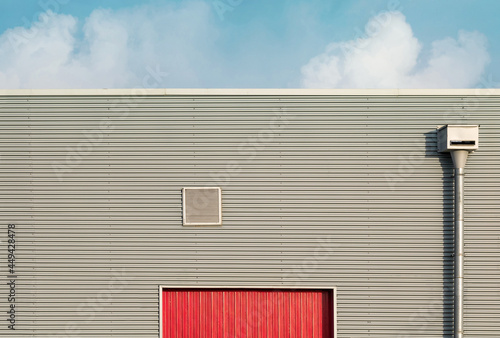 Fotografi Industrial architecture. Close up of a warehous main entrance.