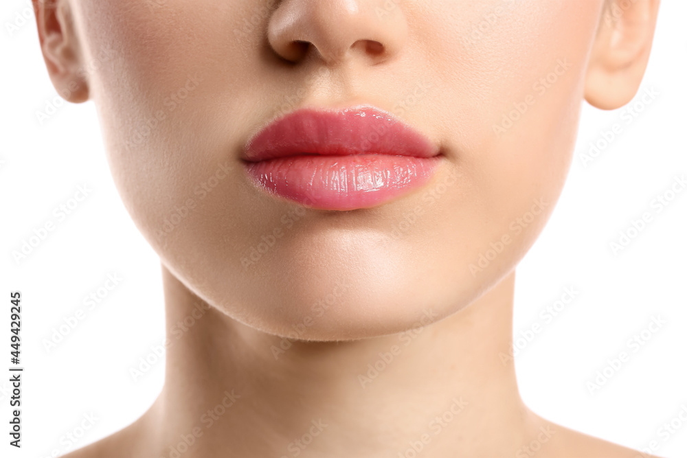 Young woman with beautiful lips on white background, closeup Young woman with beautiful lips on white background, closeup