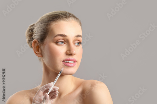 Young woman receiving fille...