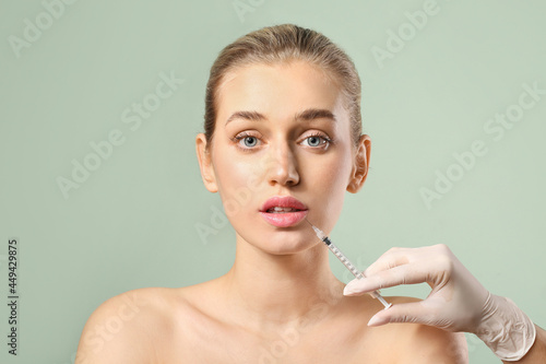 Young woman receiving fille...