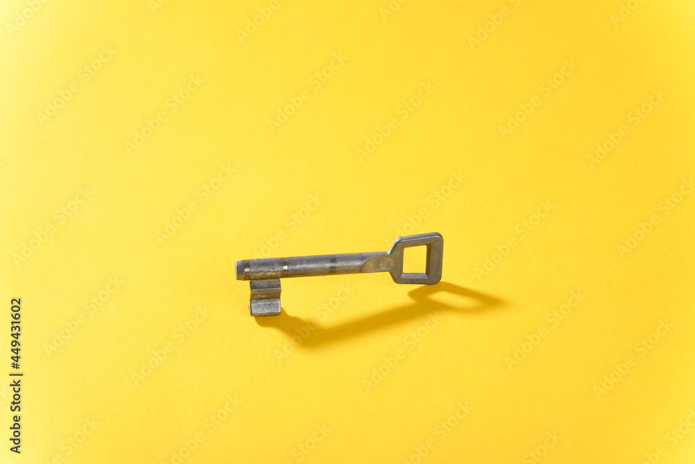 Key on yellow background close up. Key on yellow background close up.