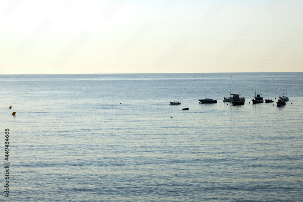 Fototapeta premium Morning landscape, sunrise over the river, sandy beach near the shore are boats.