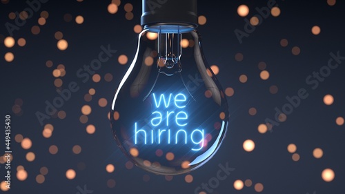 Fotografie Light bulb on announcing: we are hiring. Blue version.
