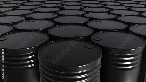 Realistic tracking camera looping 3D animation of black oil barrels rendered in UHD as motion background 