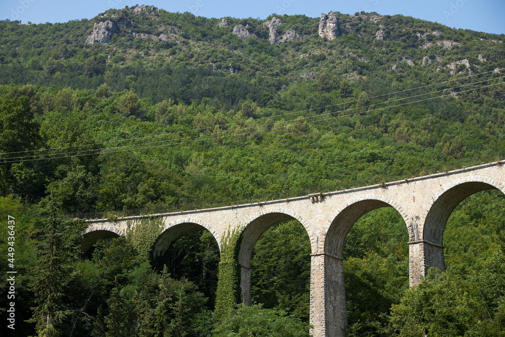 old brick bridge viaduct in the woods