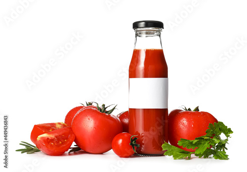 Bottle of tasty tomato juice on white background