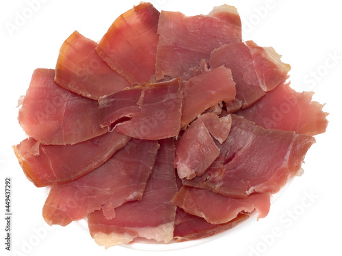 Spanish ham jamon , hand cut, sliced on a white