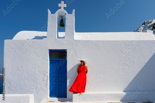 Woman in front of church in Santorini photo