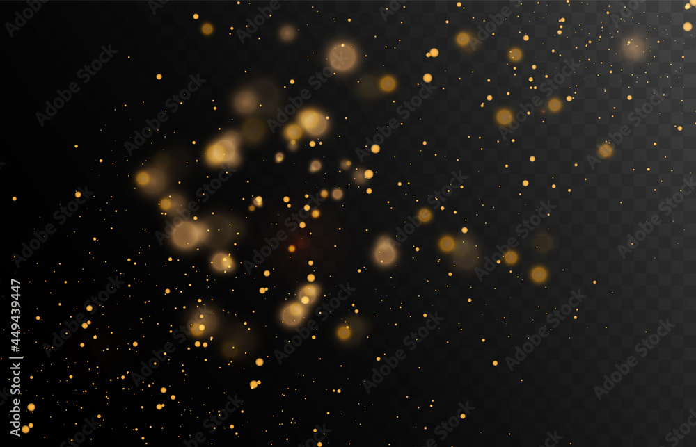Gold glitter dust on a dark background with lens flares and light effects.