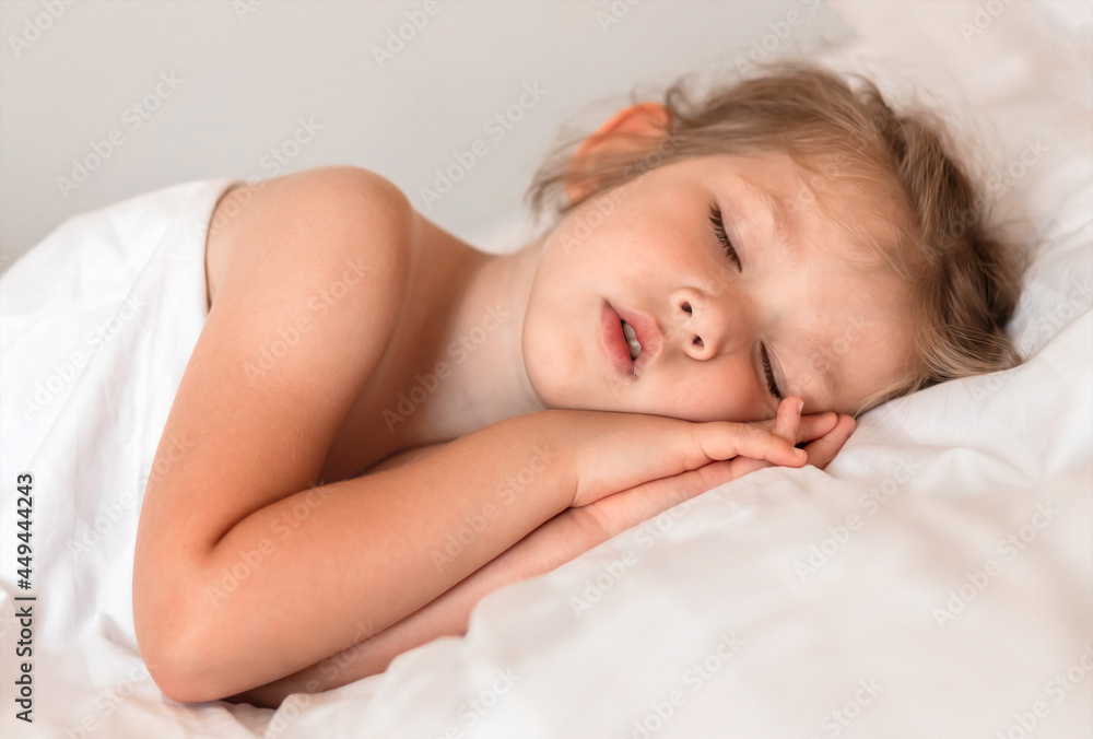Adorable little girl sleeping in bed with white linens. Place for your text. Healthy baby sleep. Adorable little girl sleeping in bed with white linens. Place for your text. Healthy baby sleep.