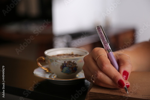 Fototapeta Naklejka Na Ścianę i Meble -  person writing on a notebook