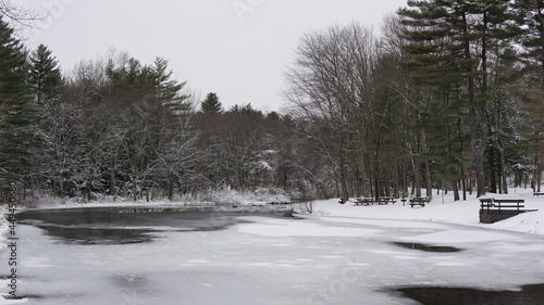 Frozen pond with snow and trees.  Forest.  Winter scene.  Stratton Brook State Park Simsbury Connecticut.