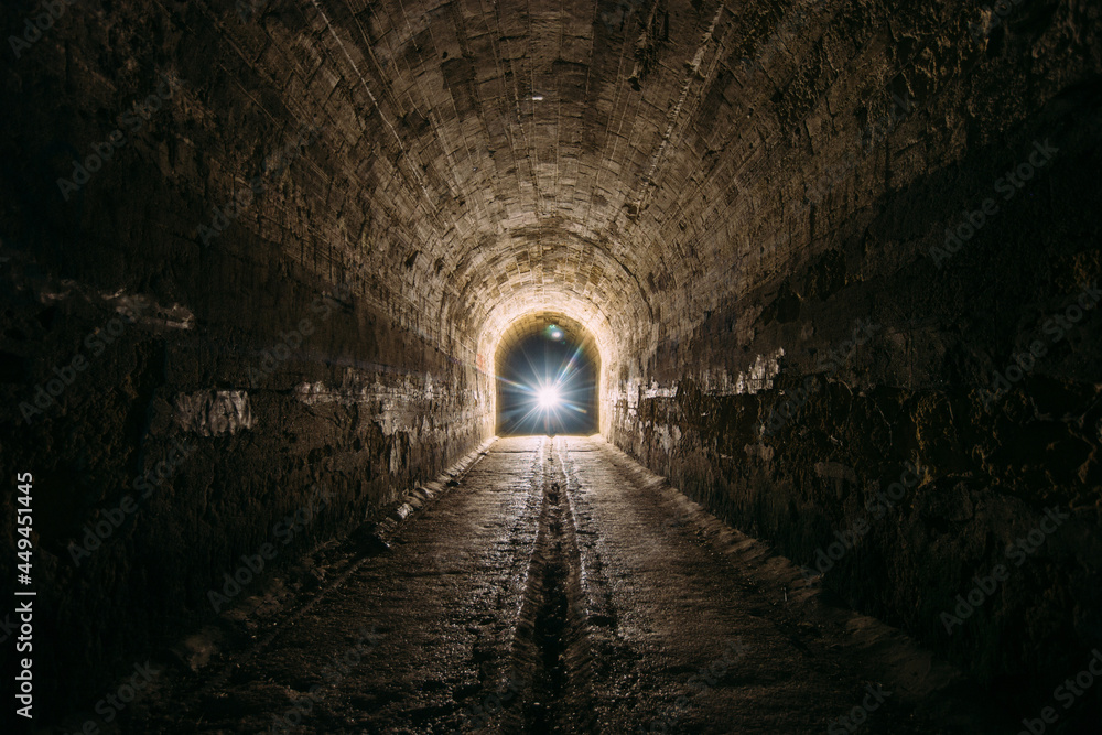 Dark and creepy old historical vaulted underground road tunnel