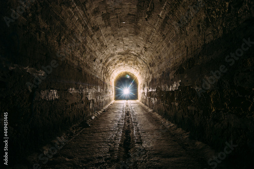 Dark and creepy old historical vaulted underground road tunnel