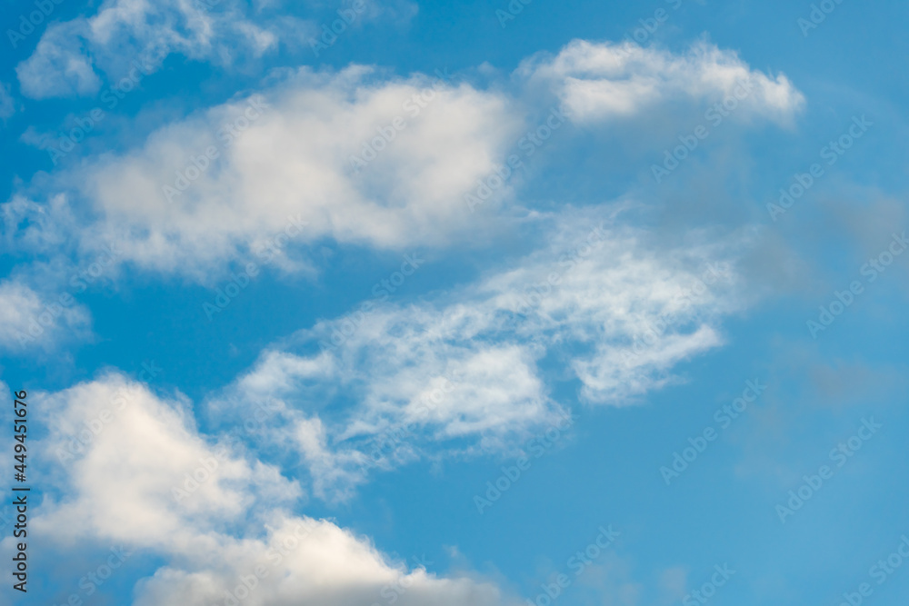 fluffy gentle clouds slowly and hopelessly float across the endless sea of blue sky. Clear blue sky after the raging elements and storms. fluffy gentle clouds slowly and hopelessly float across the endless sea of blue sky. Clear blue sky after the raging elements and storms.