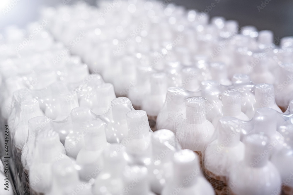 Fototapeta premium cosmetics production - industry - plastic packaging - white plastic bottles
