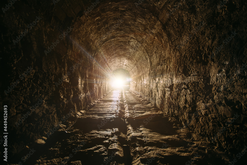Dark and creepy old historical vaulted underground road tunnel - obrazy, fototapety, plakaty 