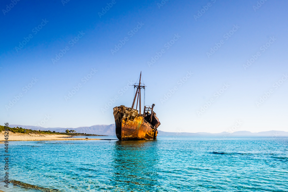 Rusty and abandoned shipwreck on a coastline near Gythio in Lakonia, Peloponnese Greece Rusty and abandoned shipwreck on a coastline near Gythio in Lakonia, Peloponnese Greece