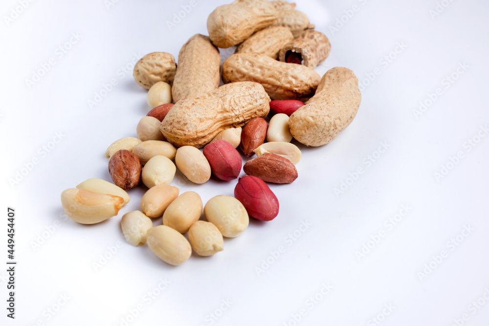 Peeled peanuts and peanut pod isolated on white background. Peeled peanuts and peanut pod isolated on white background.