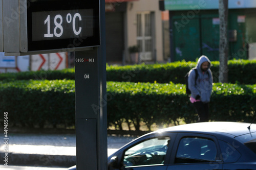Temperature thermometer on street displays digital celsius degrees. Meteorology and weather device, climate change, global warming indicator.