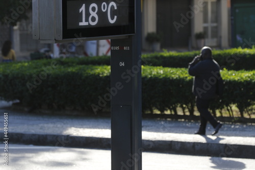 Temperature thermometer on street displays digital celsius degrees. Meteorology and weather device, climate change, global warming indicator.