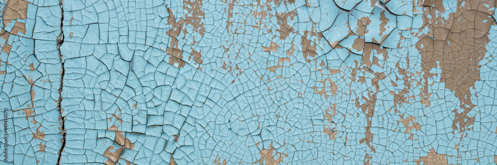 Peeling paint on the wall. Panorama of a concrete wall with old cracked flaking paint. Weathered rough painted surface with patterns of cracks and peeling. Wide panoramic texture for design background Peeling paint on the wall. Panorama of a concrete wall with old cracked flaking paint. Weathered rough painted surface with patterns of cracks and peeling. Wide panoramic texture for design background