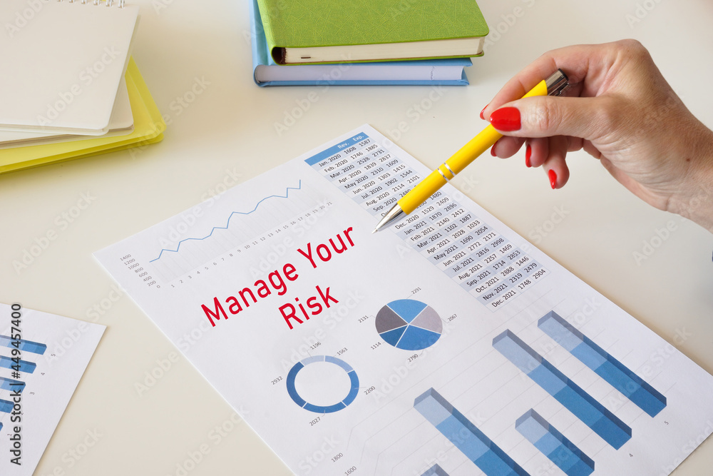 Financial concept about Manage Your Risk with sign on the page. Financial concept about Manage Your Risk with sign on the page.