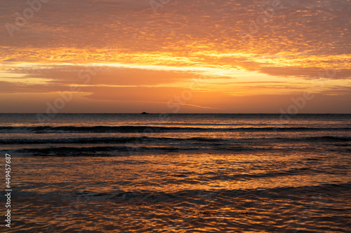 Beautiful sunset with reflections on the water. Brazilian beach located in Jericoacoara  Ceara.