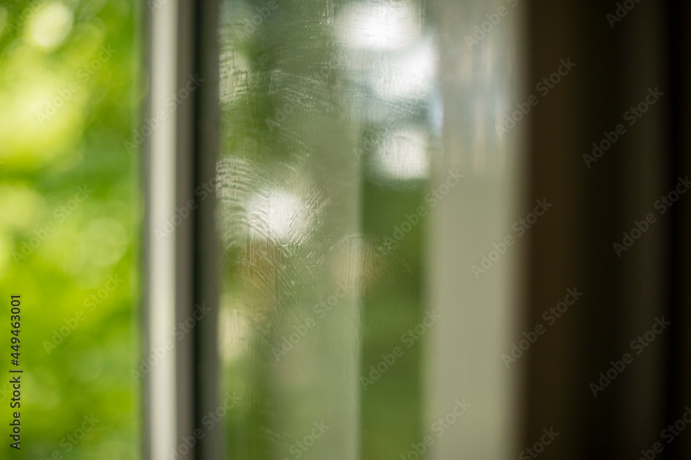 Fototapeta premium The surface of the washed window. Glass on a summer day.