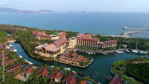 A modern seaside city in southern China with upscale villas and coconut trees photo