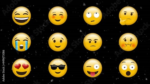Digital animation of white particles falling over multiple face emojis against black background photo